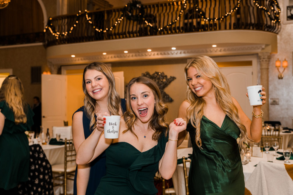 Three women celebrating at a wedding reception at Morais Vineyards and Winery