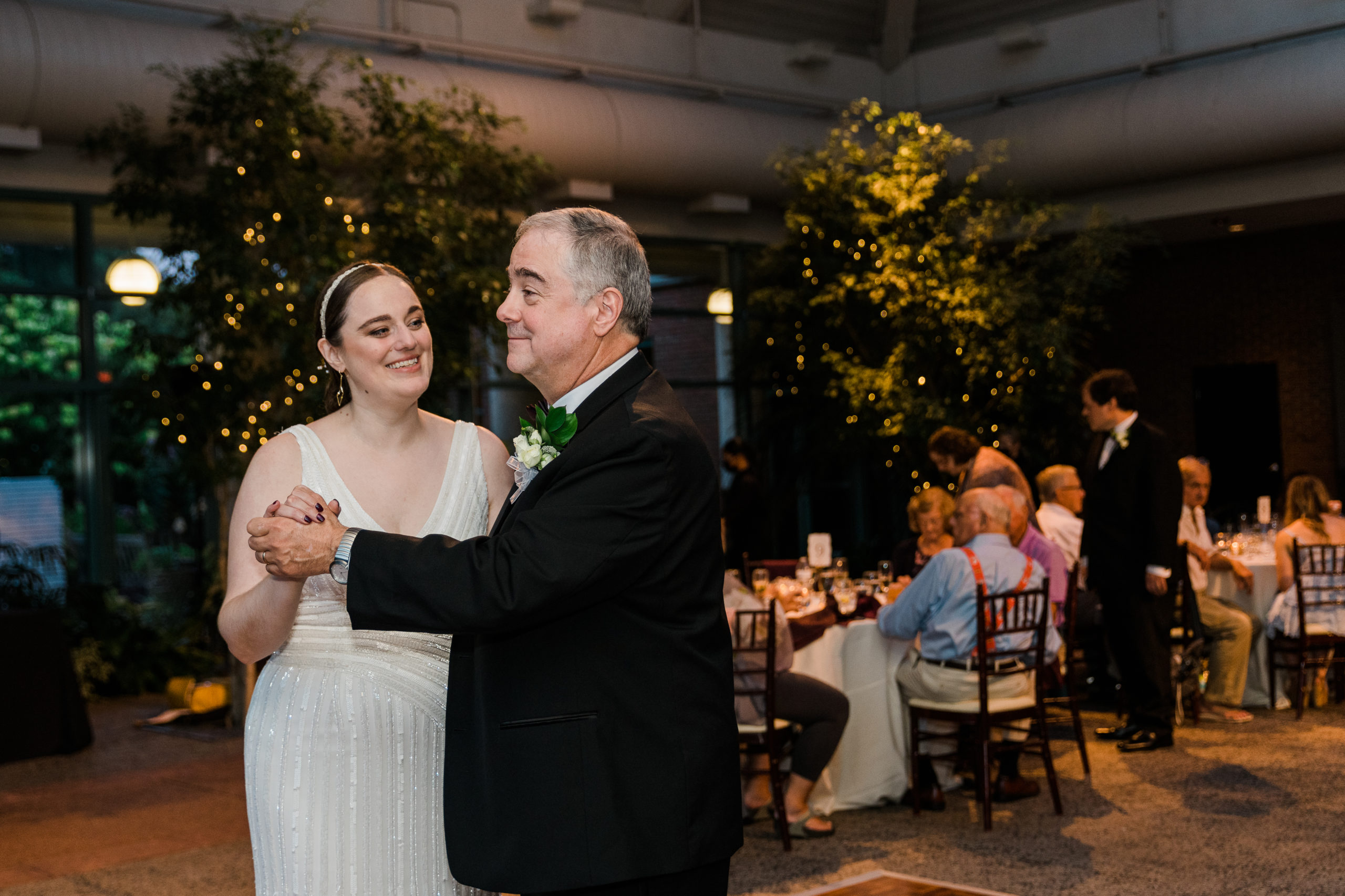 Bride dancing with her father at a wedding reception at the Atrium at Meadowlark Botanical Gardens