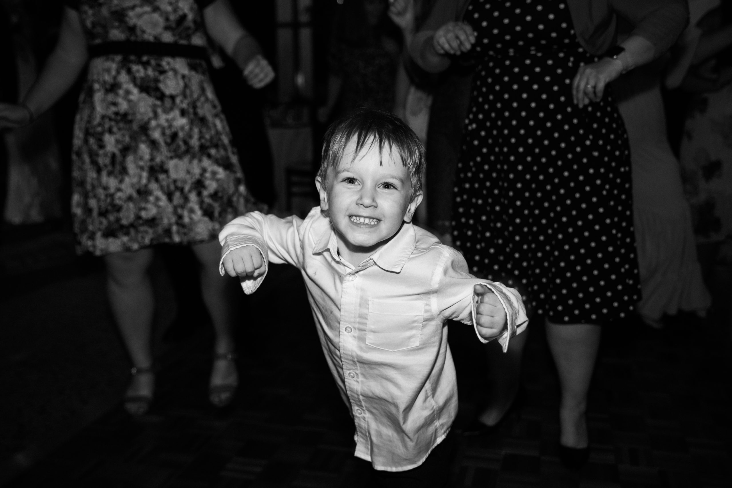 A guest dancing at a wedding reception at the Atrium at Meadowlark Botanical Gardens