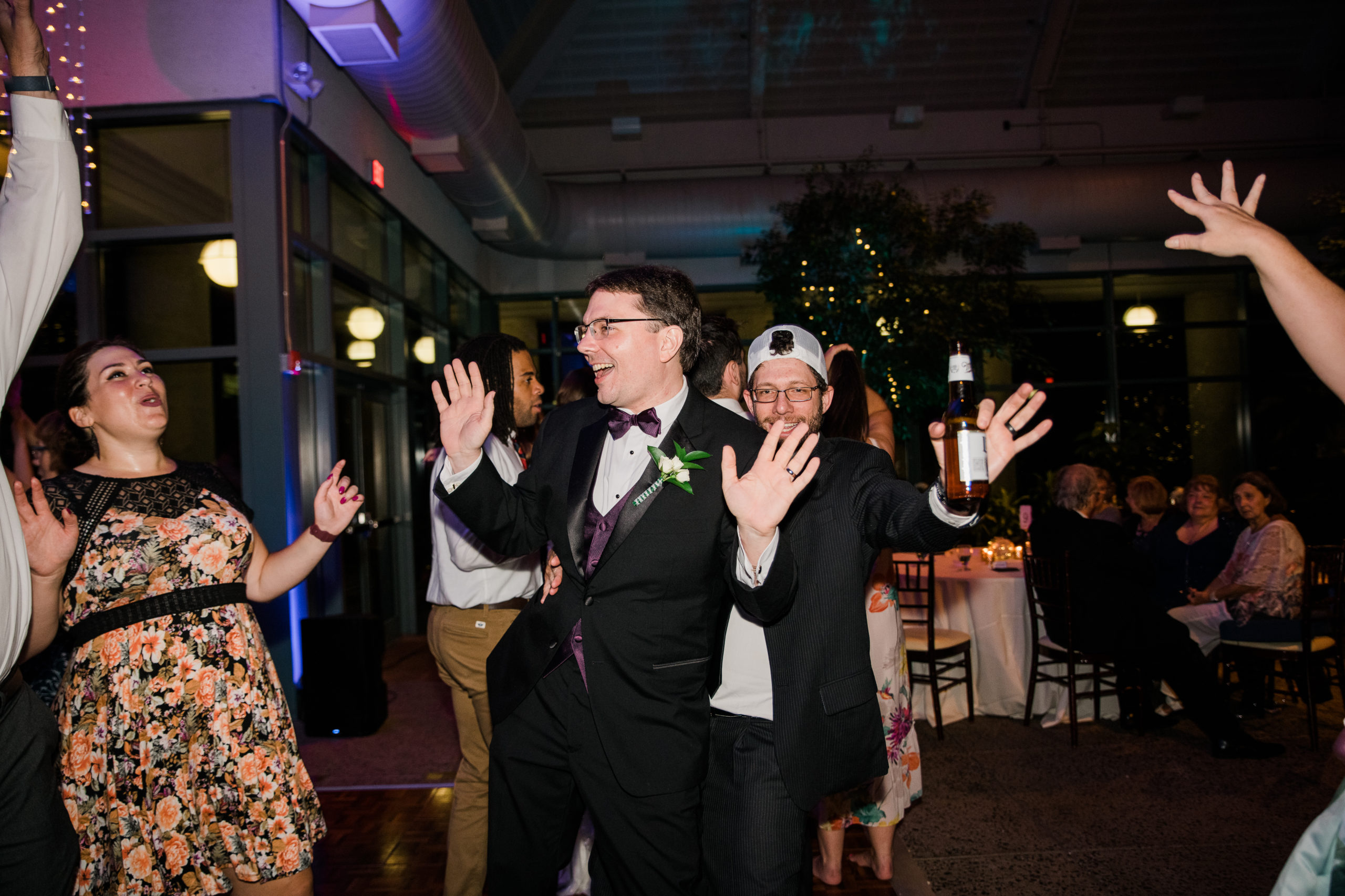 Groom dancing at a wedding reception at the Atrium at Meadowlark Botanical Gardens