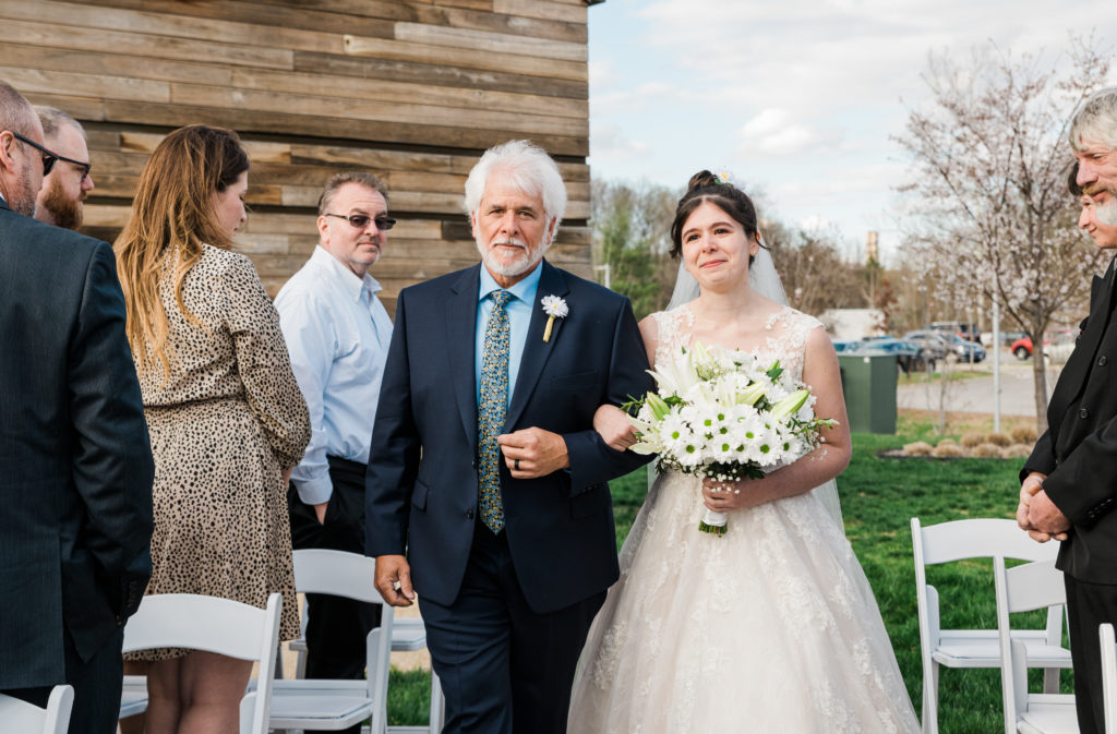 Father walking a bride down the aisle at the River View at Occoquan