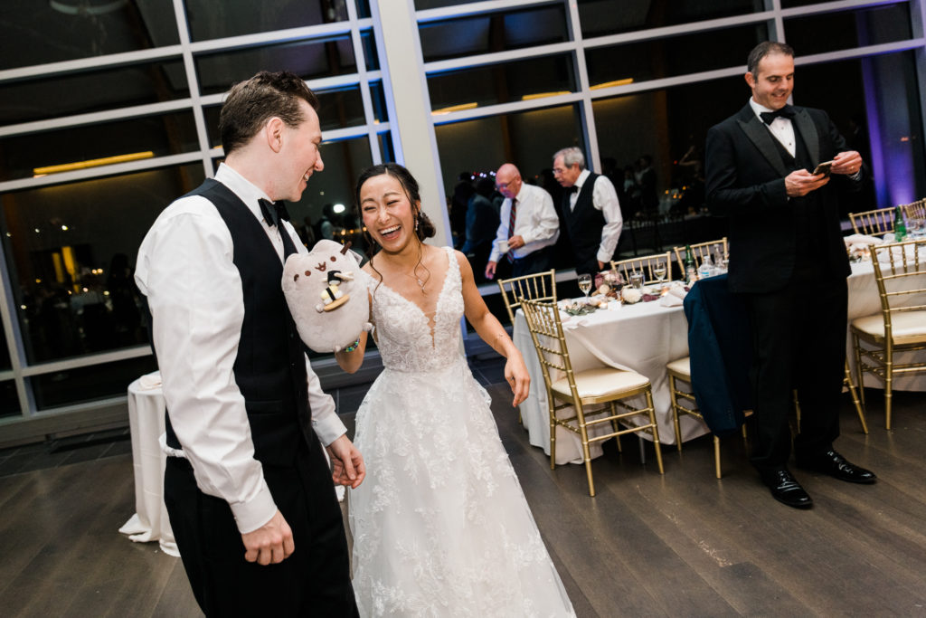 The bride and groom dancing on a dance floor