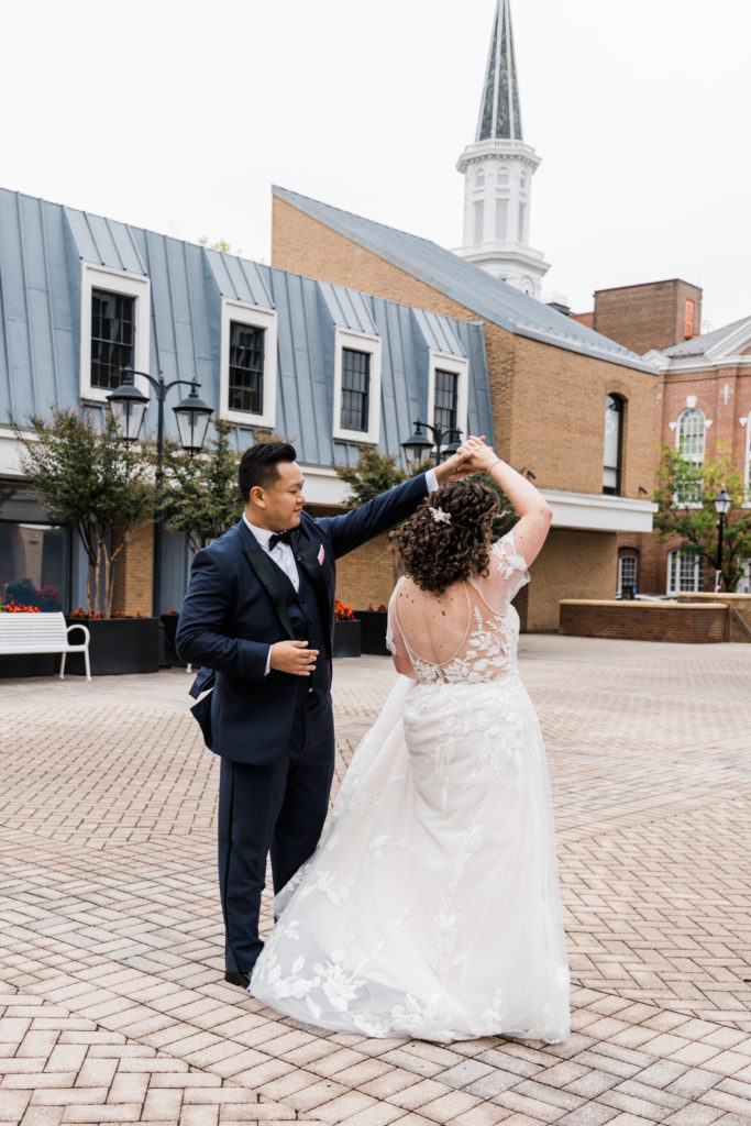 A groom twirling a bride