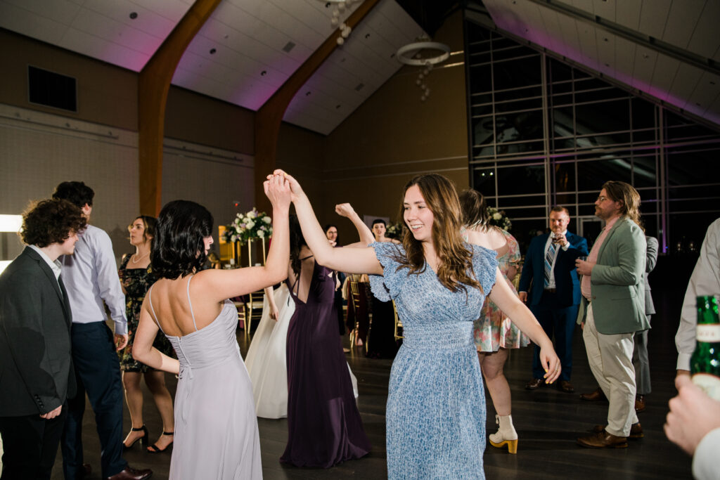 Two women in dresses dancing together