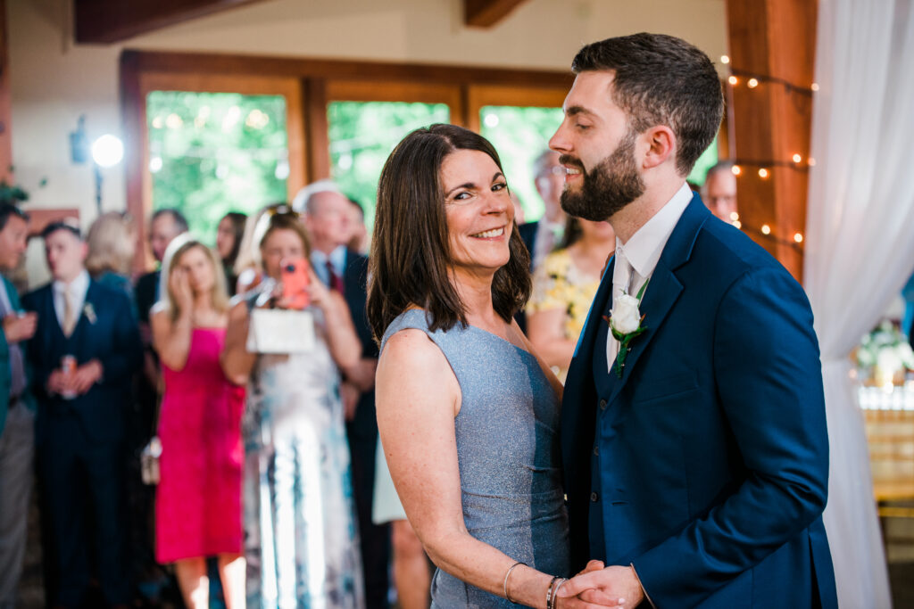 A groom dancing with his mother