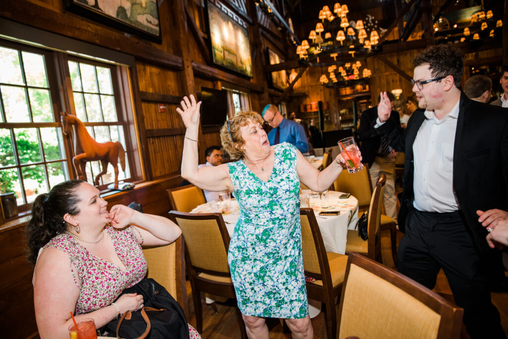 A woman dancing at a wedding reception